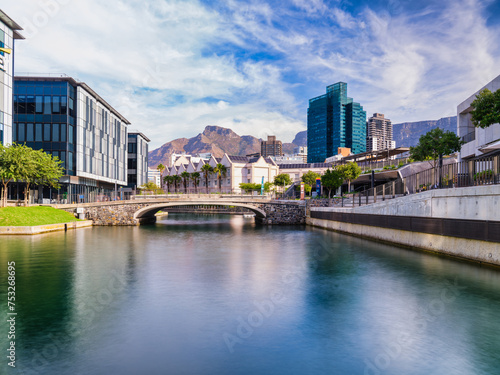 V and A Waterfront's canal and Cape Town city with the table mountain in the background, Cape Town, South Africa photo
