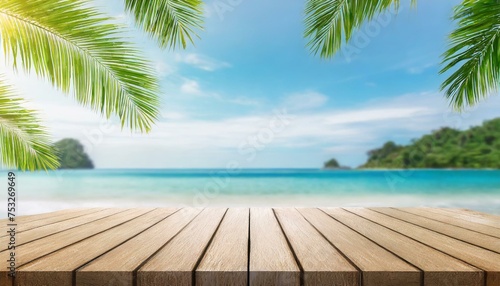 wood table with seascape and palm leaves  blur bokeh light of calm sea and sky at tropical beach background