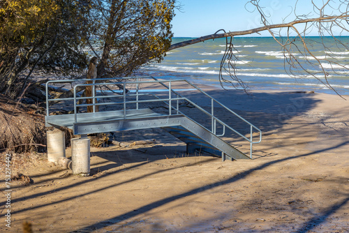 Pre-fabricated beach steps not connected to the land because of wave action and beach erosion on Lake MIchigan. 