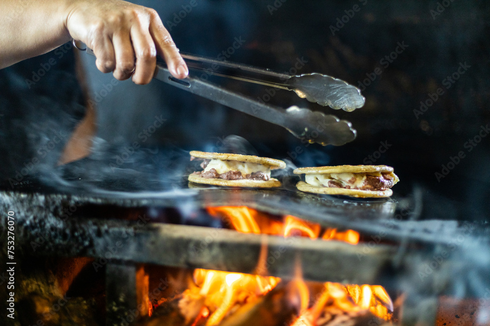Fototapeta premium Making flour tortillas for the Honduran tortillas with melted cheese