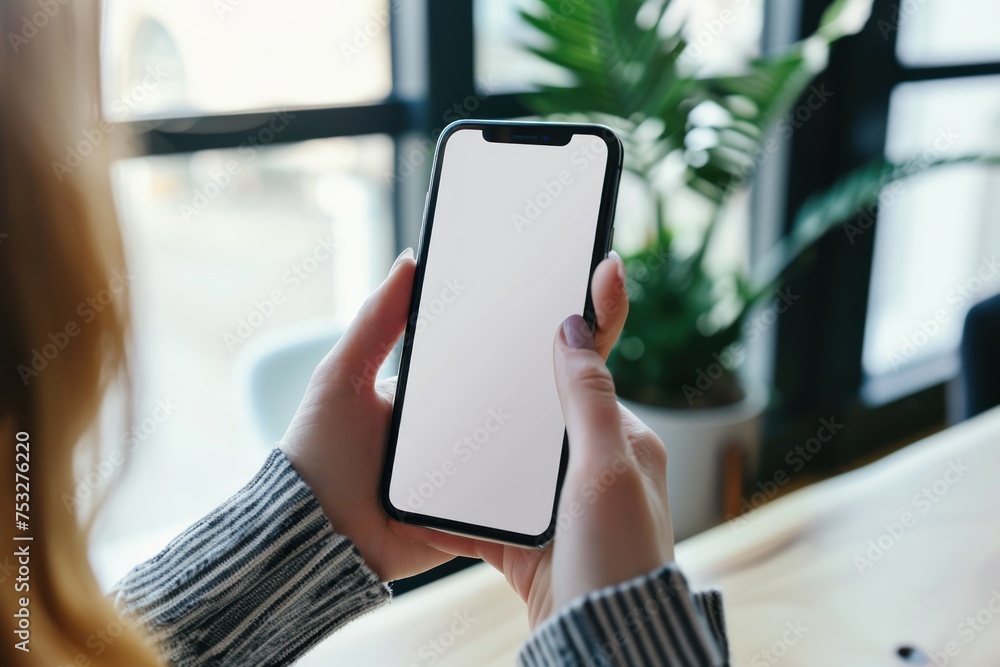 Hand holding smartphone with blank screen isolated. Smartphone Mockup for Designers. Mockup. Chroma key. Blank screen. Template.