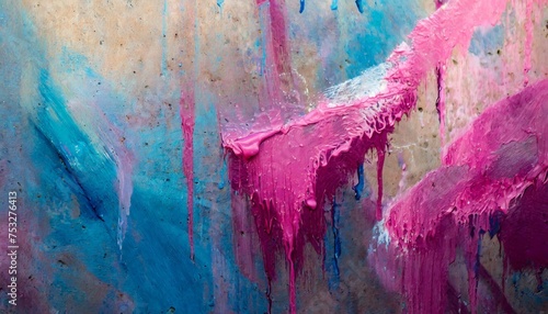 Abstract messy paint strokes and smudges on an old painted wall. Pink, purple, blue color drips, flows, streaks of paint and paint sprays photo
