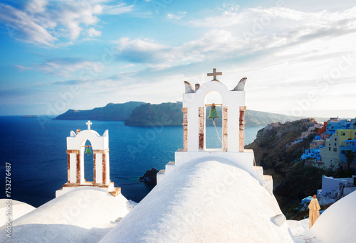 white church belfries and volcano caldera with sea landscape, beautiful details of Santorini island, Greece, retro toned photo