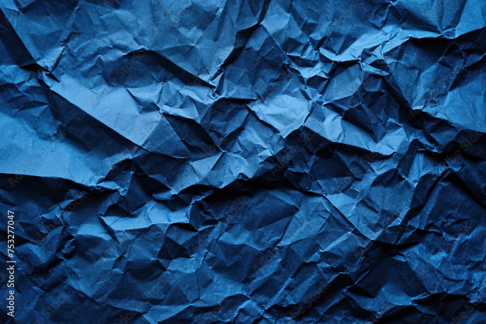 Fototapeta premium Navy blue paper crumpled texture background