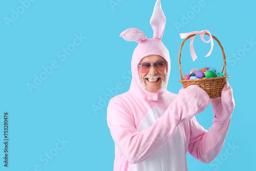 Senior man in bunny costume...