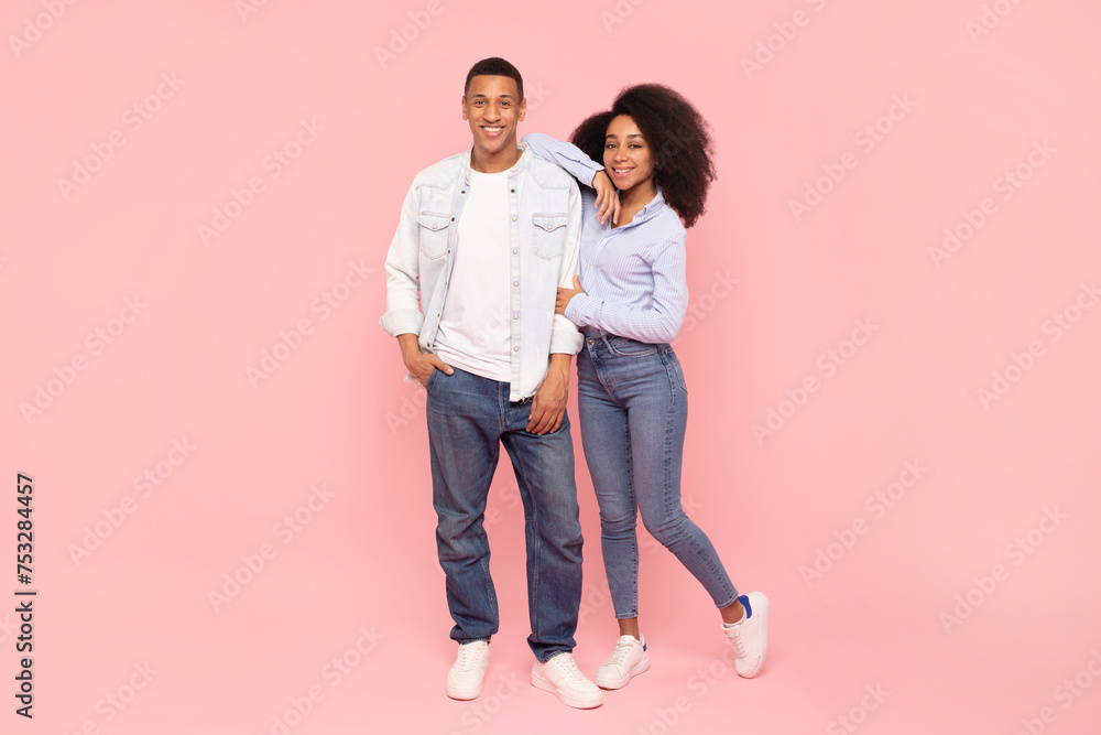 Full length shot of african american couple hugging and smiling at ...