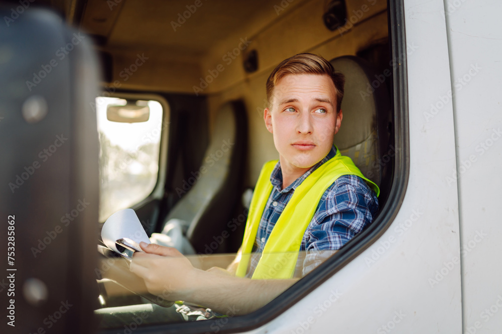 Truck driver job. Logistics - proud driver or forwarder on truck and trailer, on a transshipment point. Transportation service. Truck driver job. Logistics - proud driver or forwarder on truck and trailer, on a transshipment point. Transportation service.