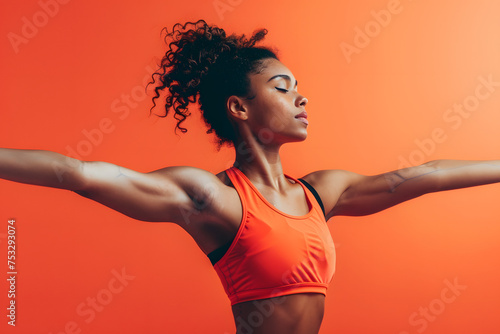 Fitness enthusiast in mid-stretch, focused and determined, vibrant coral background