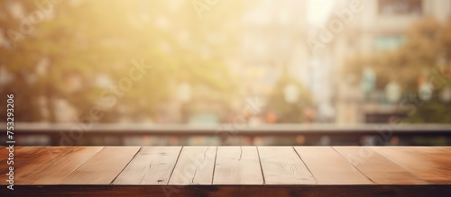 Empty wooden board with blurred window as background