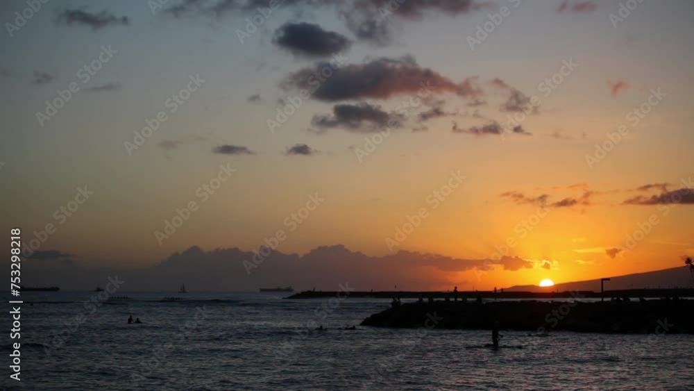 Sun setting over ocean and land - wide shot Sun setting over ocean and land - wide shot