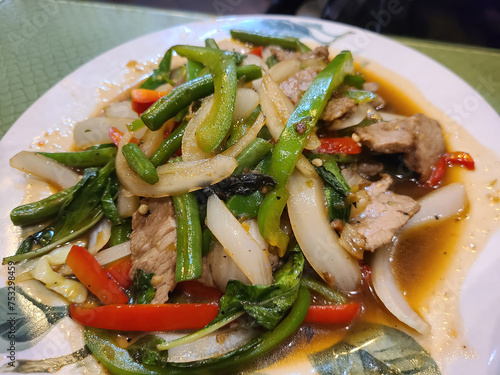 Savory Asian Stir-Fry with Vegetables and Meat on White Plate