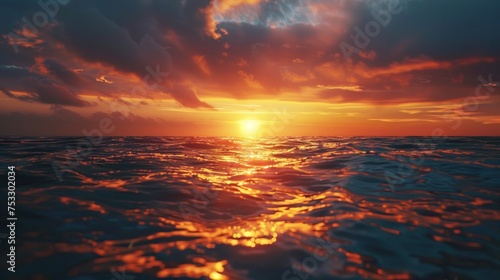 A sunset over the ocean with waves crashing on the shore and clouds over the ocean and beach