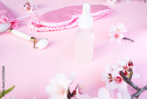 spring flowers with sleeping mask with bottle with cure, sleep-wake disorders concept, insomnia therapy, sleep difficulties and deprivation