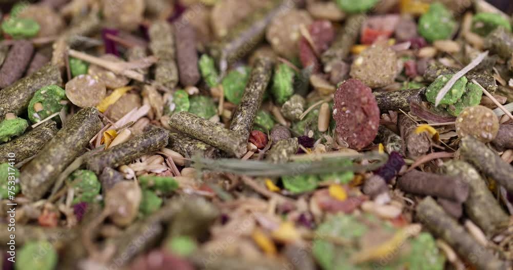combined feed for rodents from hay, corn, cereals, vegetables, close-up of ingredients mixed for rodents combined feed for rodents from hay, corn, cereals, vegetables, close-up of ingredients mixed for rodents