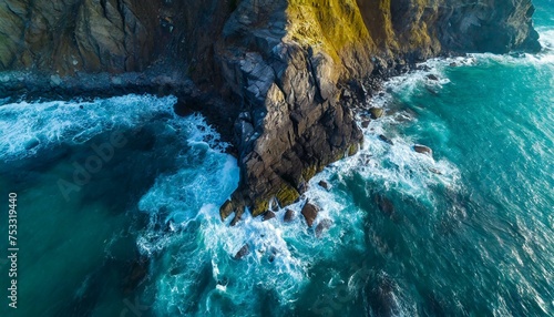 Aerial view of sea waves and fantastic Rocky coast. Summer seascape from drone. Travel concept.