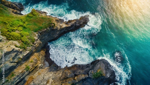 Aerial view of sea waves and fantastic Rocky coast. Summer seascape from drone. Travel concept