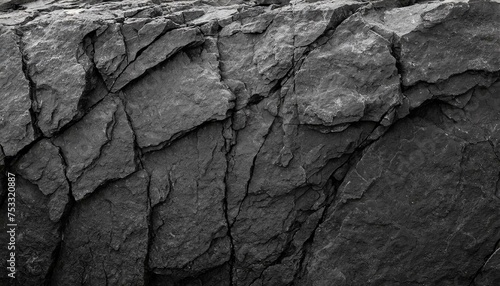 Rock texture with cracks,black stone background with copy space for design.