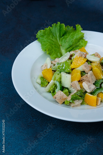 Asian Chicken Salad served on a white plate, social media post, food photography, fine dining, blue background, restaurant menu, Healthy, lifestyle, diet, vegan