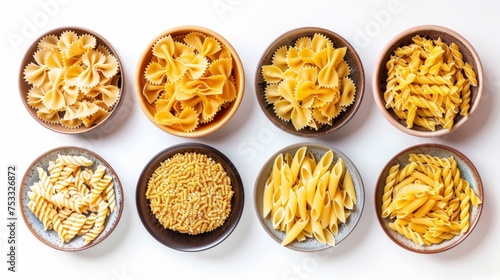 Set of various types of pasta in bowl, isolated on white background, top view photo