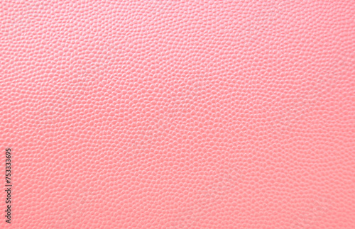 Pink glossy pebbled leather pattern as texture or background