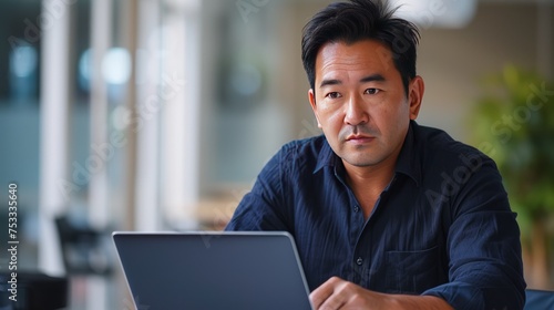 Man works on a laptop