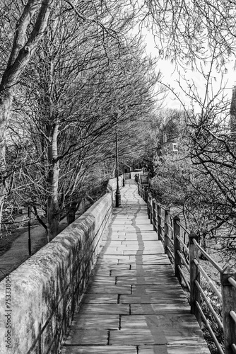 Chester City Walls, ancient defensive walls surrunding the old town of Chesteer, Cheshire, England, UK in black and white © PhotoFires