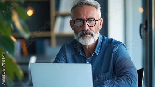 Man works on a laptop 