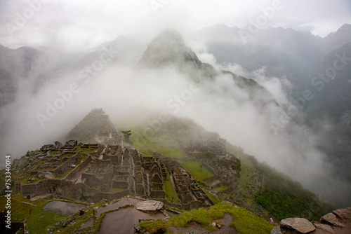 Machu Picchu is an iconic archaeological site located in the Andes Mountains of Peru. It is one of the most famous and visited tourist destinations in the world.
