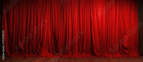Red drapes on wooden floor against brown wooden wall