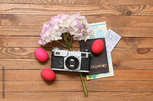 Passport with camera, flowe...