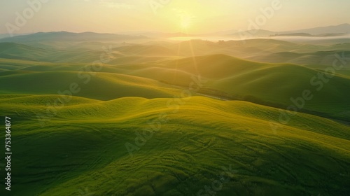 Drone perspective of a serene countryside sunrise, with mist hovering over rolling hills