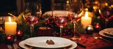 Close up of holiday table decoration with wine glasses and a plate A symbol of festive season