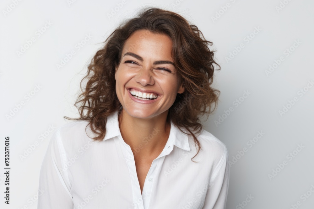 Portrait of happy young woman smiling and looking at camera isolated over white background Portrait of happy young woman smiling and looking at camera isolated over white background