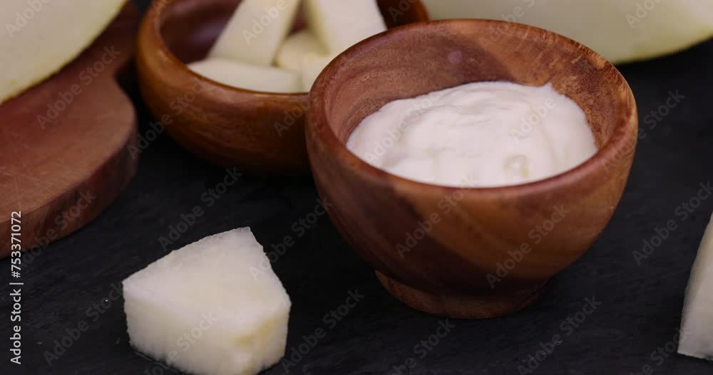 yogurt with melon flavor and ripe and delicious melon close-up, sliced ripe juicy melon in yogurt yogurt with melon flavor and ripe and delicious melon close-up, sliced ripe juicy melon in yogurt