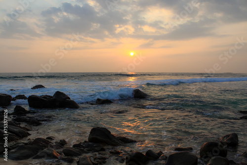 Unawatuna beach in Sri Lanka. Waves crashing on the rocks