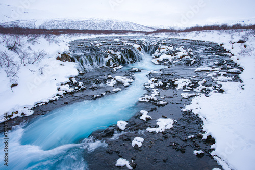 Bruarfoss waterfall in winter, a stand-out and a popular destination among travelers in the Southwest of Iceland. 
