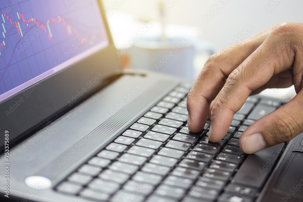 Fingers typing on the computer keyboard, simple close up with lens flare Fingers typing on the computer keyboard, simple close up with lens flare
