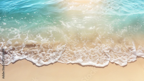 An abstract sandy beach seen from above, with clear blue water waves and sunlight, representing a summer vacation background concept for banners.