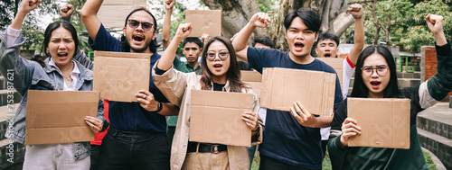 Group of activist raising hands and holding blank cardboard during a rally or demonstration © Gatot