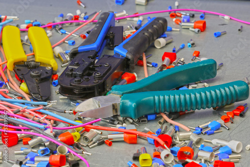 Electrical installation tools for installation of electrical panels. On a metal surface. Close-up.