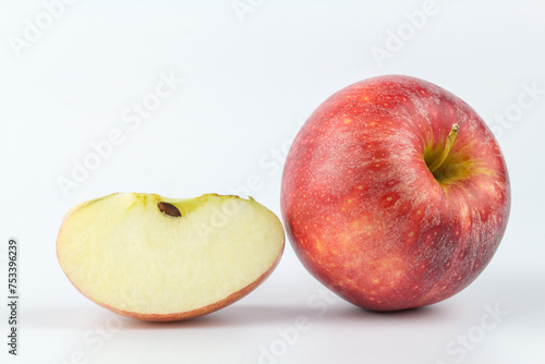 Whole red apple fruit with slice (cut) isolated on white background.
