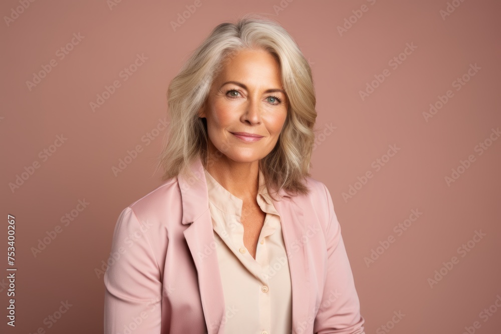 Portrait of beautiful senior businesswoman with short grey hair. Studio shot. Portrait of beautiful senior businesswoman with short grey hair. Studio shot.