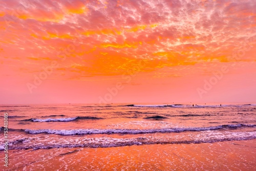 Fototapeta Naklejka Na Ścianę i Meble -  Sunrise sea sand beach in Danang,Vietnam.Inspire tropical beach seascape horizon. Orange and golden sunset sky calmness tranquil relaxing sunlight summer mood. Vacation travel holiday banner.