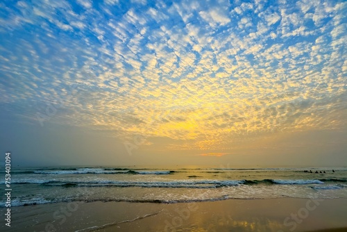 Fototapeta Naklejka Na Ścianę i Meble -  Sunrise sea sand beach in Danang,Vietnam.Inspire tropical beach seascape horizon. Orange and golden sunset sky calmness tranquil relaxing sunlight summer mood. Vacation travel holiday banner.