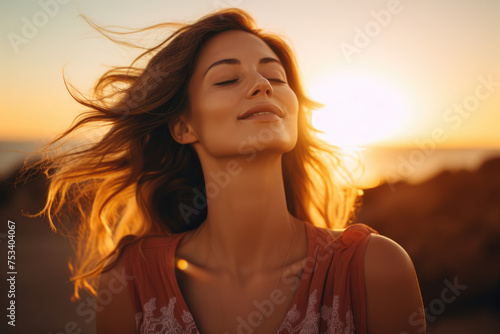 beautiful Woman with eyes closed enjoys in summer sunset © Kien