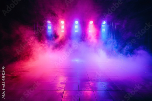 Discotheque dance floor with vibrant lights and fog for a night party © Artinun