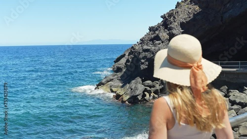 Calming sense of feminine freedom staring at shores of Candelaria Tenerife Spain photo