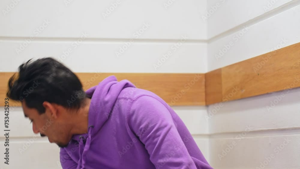 Handsome Sri Lankan man with purple jumper, front view Handsome Sri Lankan man with purple jumper, front view