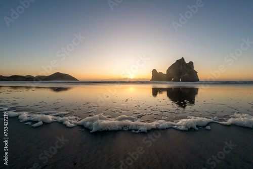 Golden Hour Serenity  Sunset Landscape Overlooking Wharariki Beach and the Tasman Sea  South Island  New Zealand