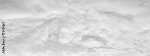 White cloud in the sky. View on a soft white fluffy cloud as background. Cloudy sky, white clouds, black background pattern. 